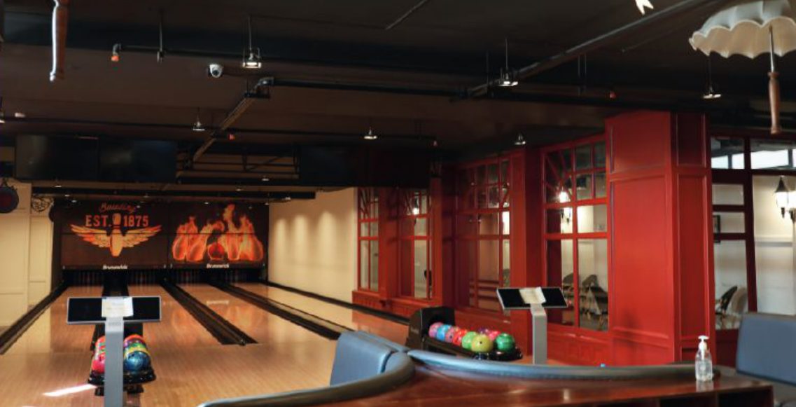 bowling lanes with circus-themed red walls