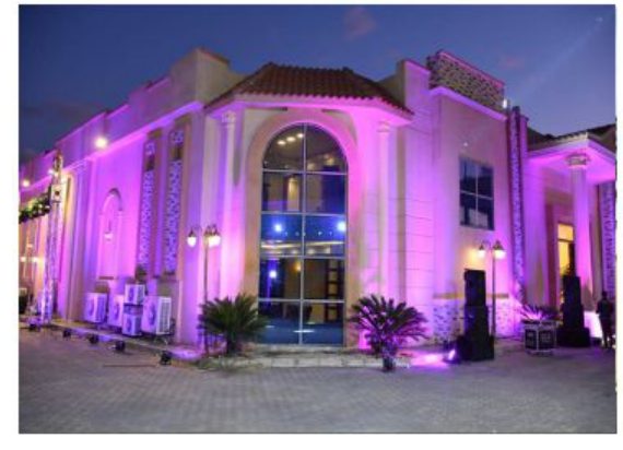 purple-lit classical facade at dusk
