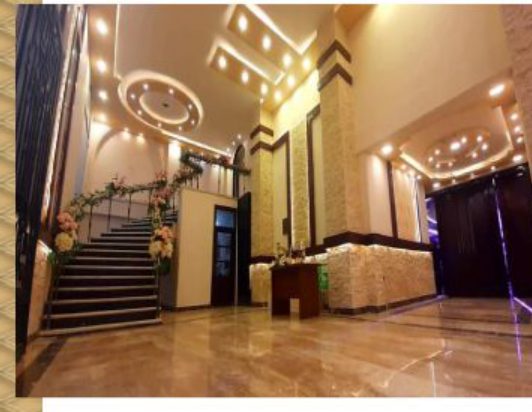 foyer with crystal chandeliers and stair