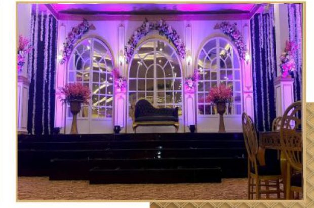 arched stage backdrop with uplighting